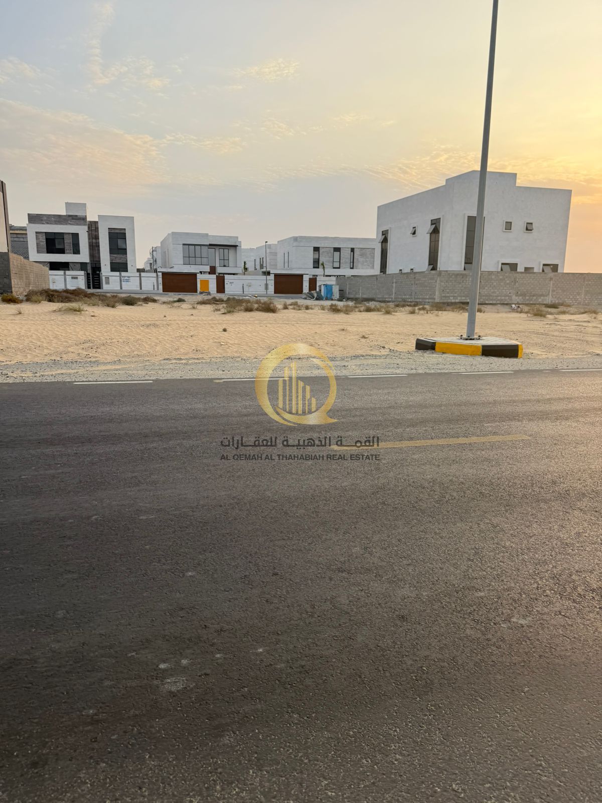 For sale: corner commercial land in Al-Houshi, area 6006 sq ft, corner on two streets, next to the roundabout on Mleiha Street, residential and commer