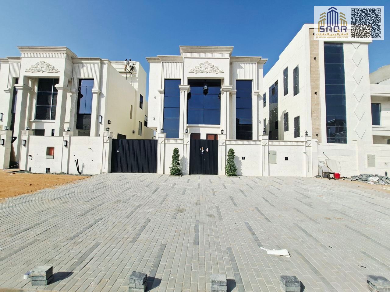 Classic 5-bedroom villa with a roof terrace for sale in Al Helio 2, Ajman. Includes registration fees and freehold ownership.