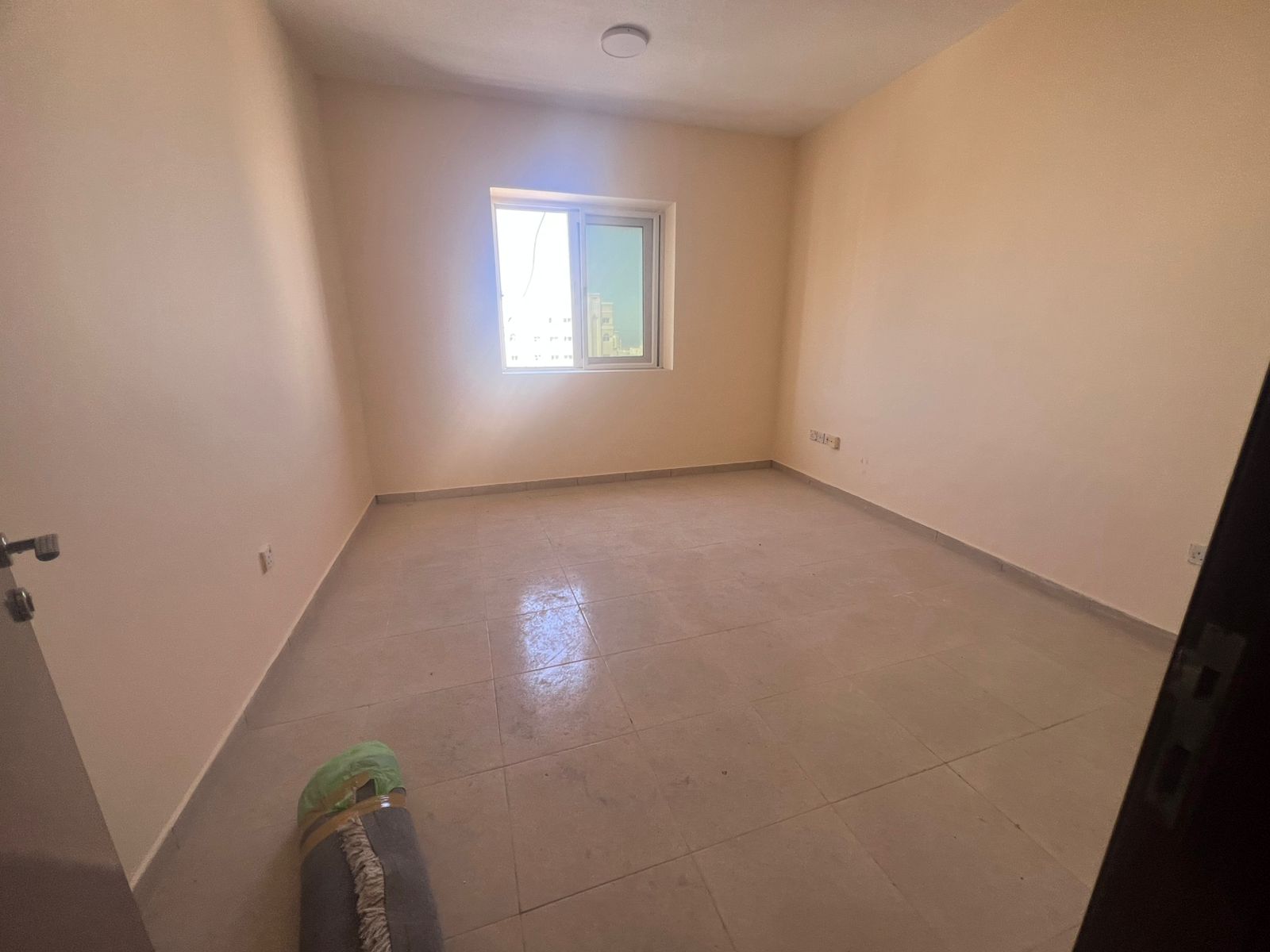 Beautiful one-bedroom apartment with living room in Al Butina, featuring a stunning open city view and central air conditioning.