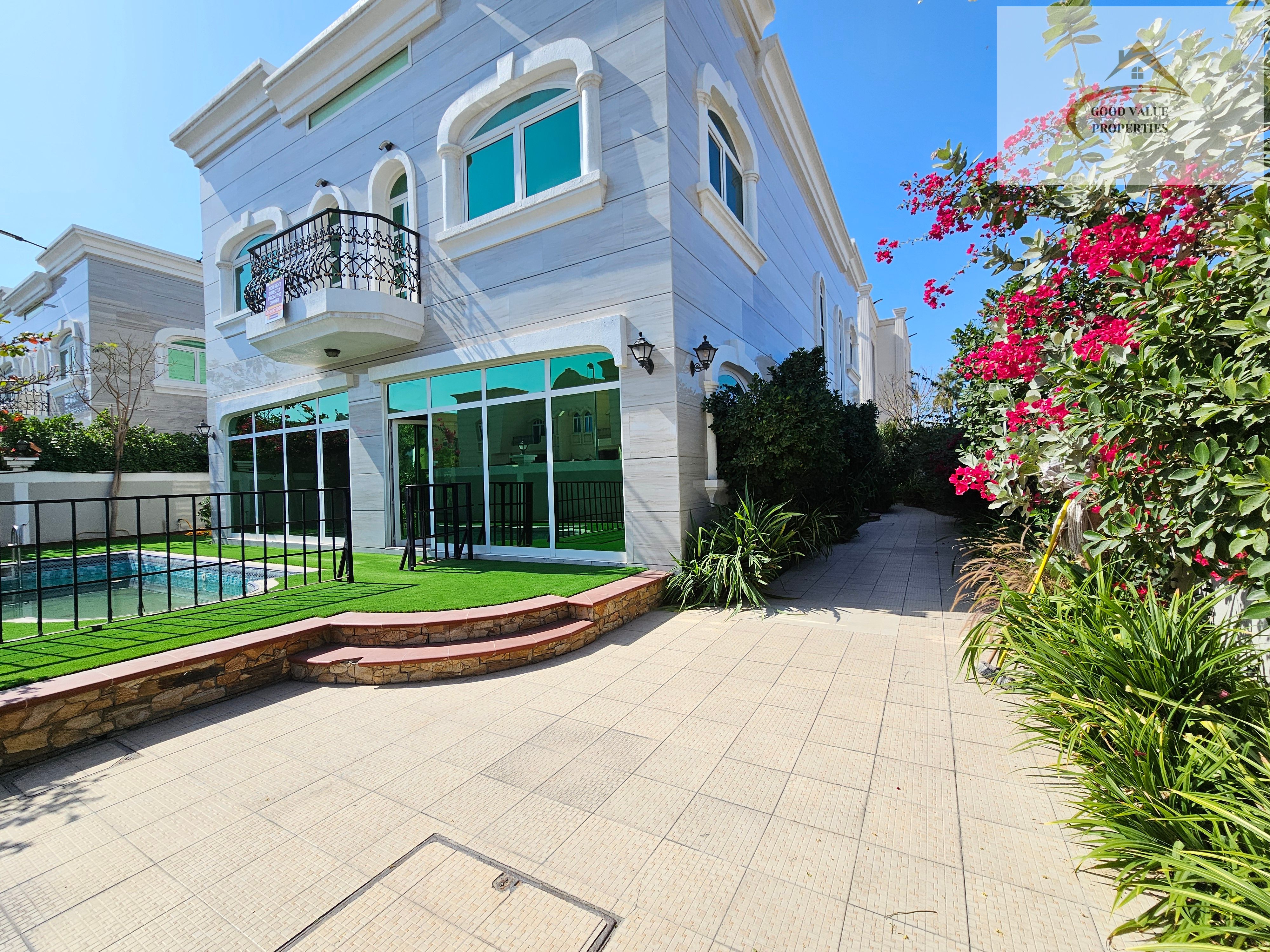Spacious 4 Bhk villa with big green garden and swimming pool
