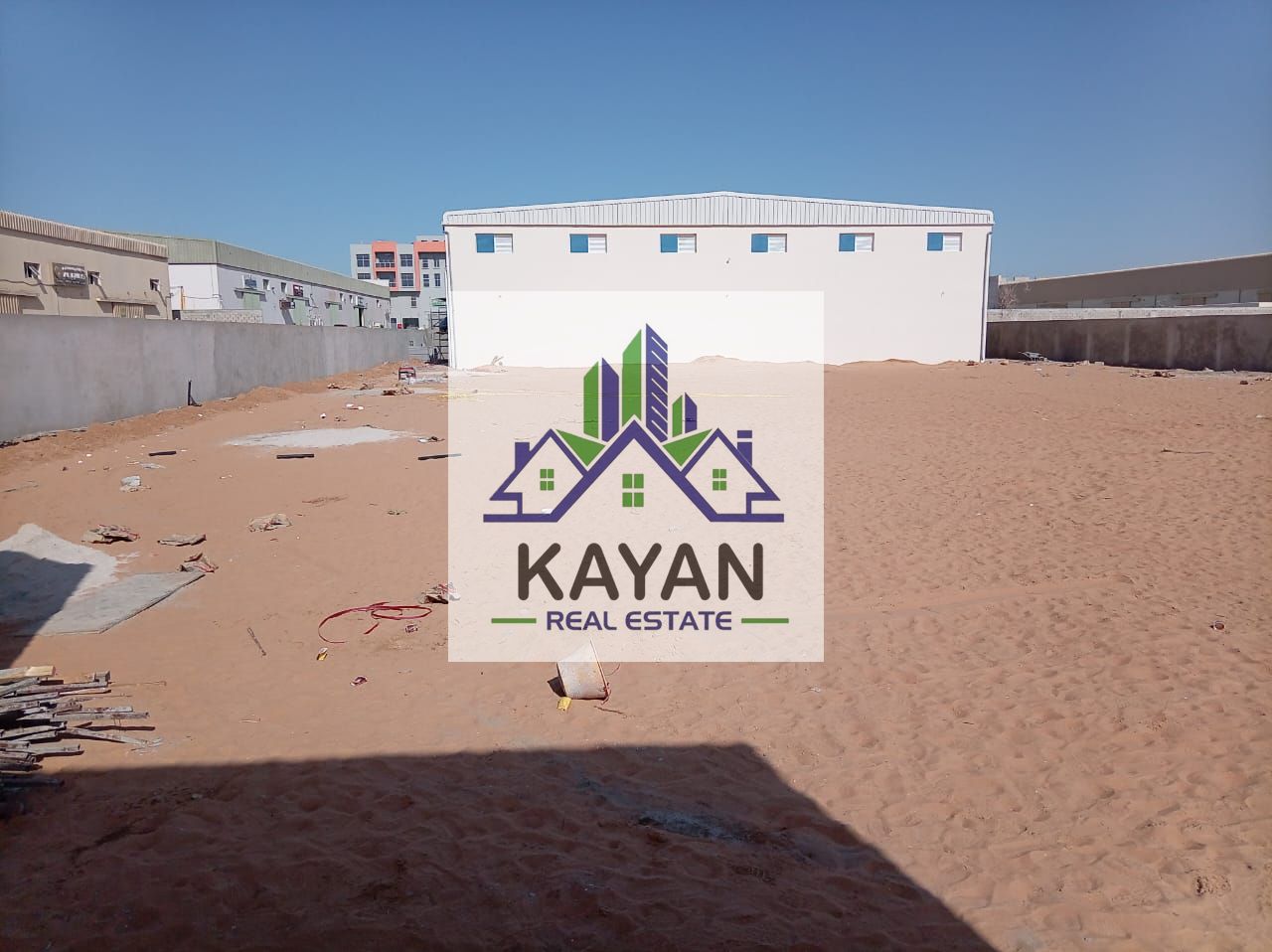 Industrial yard for rent with a total area of 36,000 sq. ft. direct from owner , featuring two warehouses 7,000 sq. ft