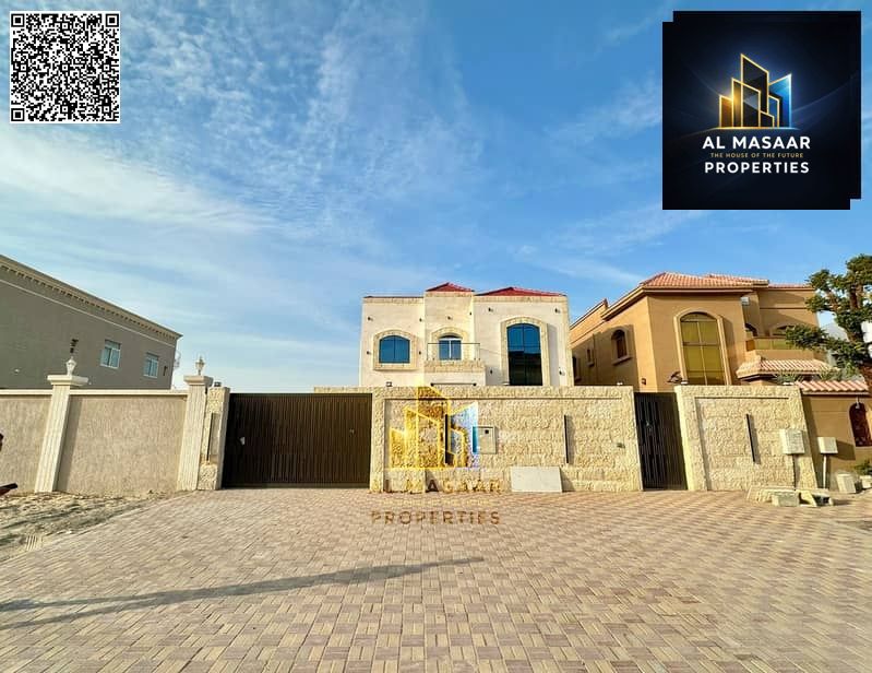 Villa in Al Muwaihat, large area, includes electricity, water, and air conditioning, close to all services, freehold ownership for all nationalities.