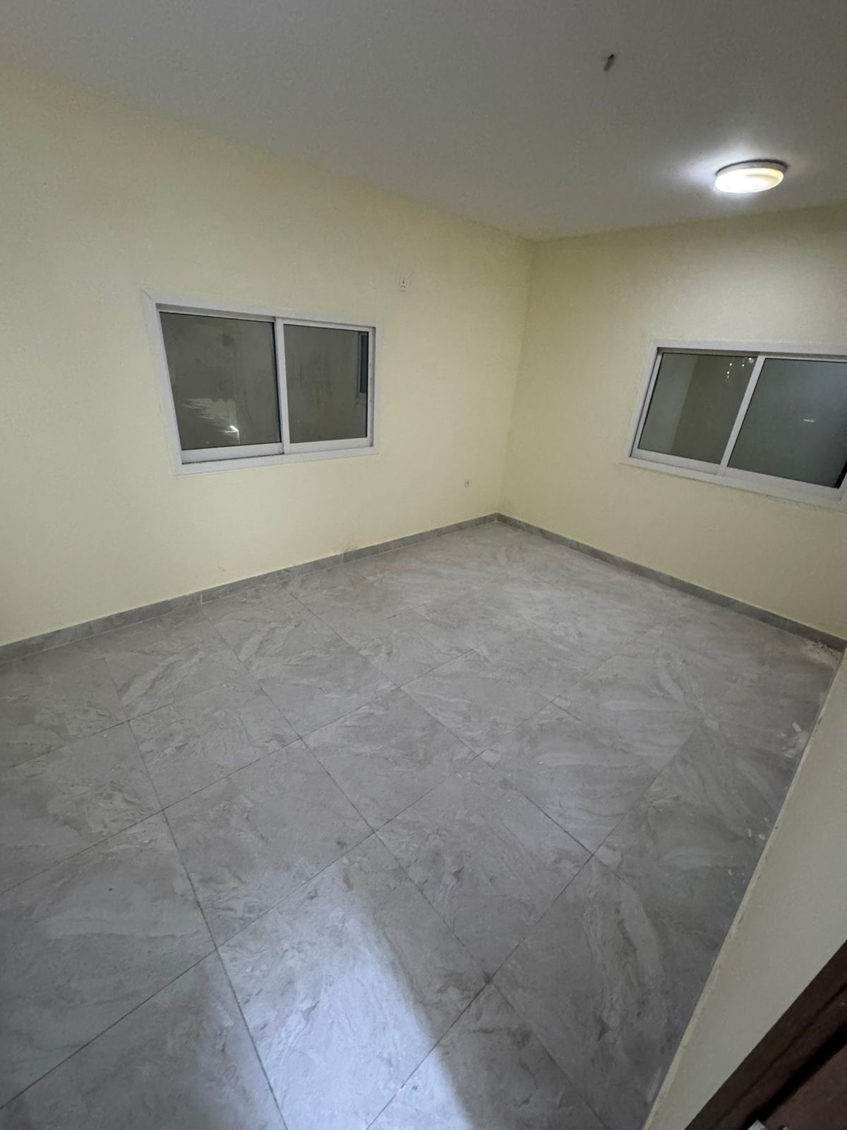 Monthly 1BR apartment in Al Nuaimiya 2, practical layout, ideal for bachelors, prime location near services, ready to move in.