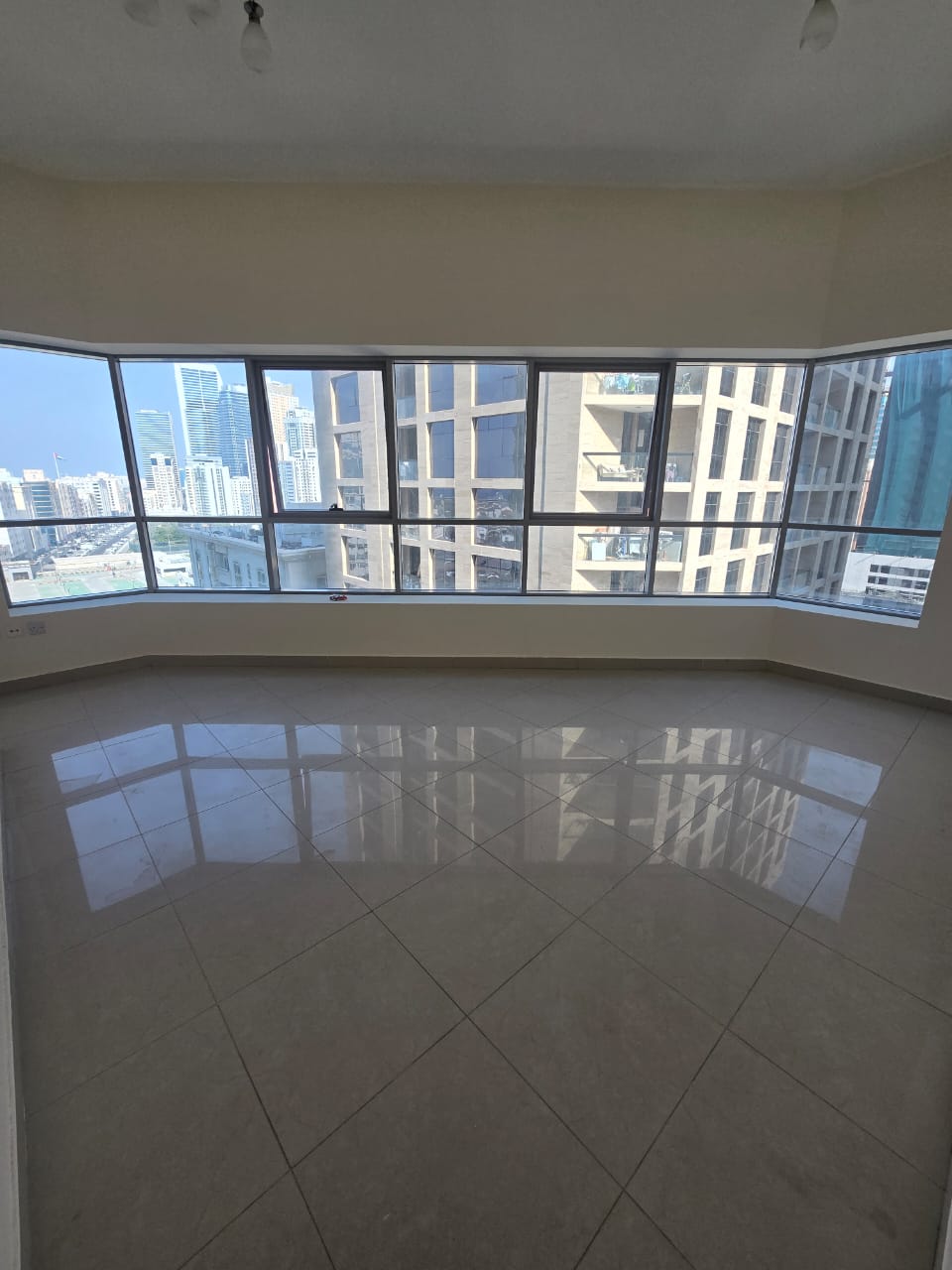 For rent in Al Khan, 3 master bedrooms and 4 bathrooms, open view, parking and gym, facilities, 65,000 dirhams.