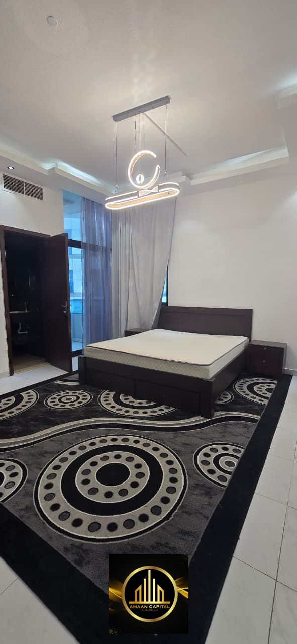 Two bedrooms and a spacious living room for sale in one of Ajman's best towers