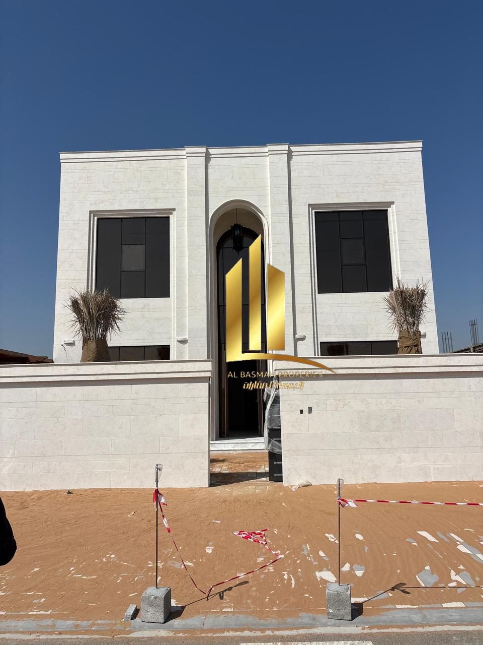 A modern villa in Al-Hawshi completely clad in stone.