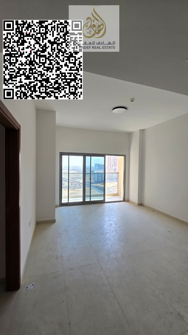 One bedroom, living room, two bathrooms, balcony, built-in wardrobes, and an open kitchen.