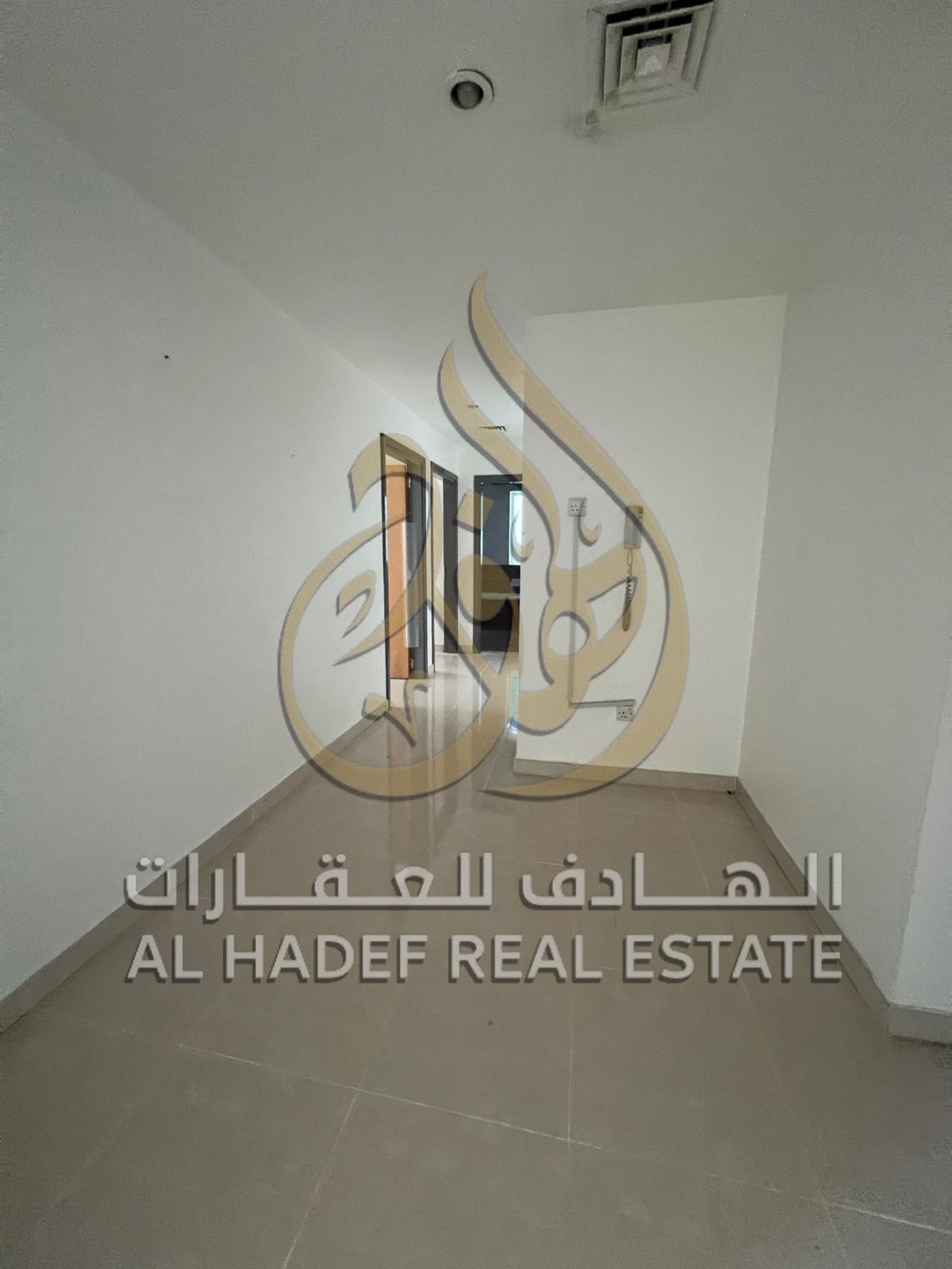 For rent in Al Majaz 1 – 2BR apartment with living room on King Faisal Street, AC by landlord, 15 days free, rent AED 55,000/year.