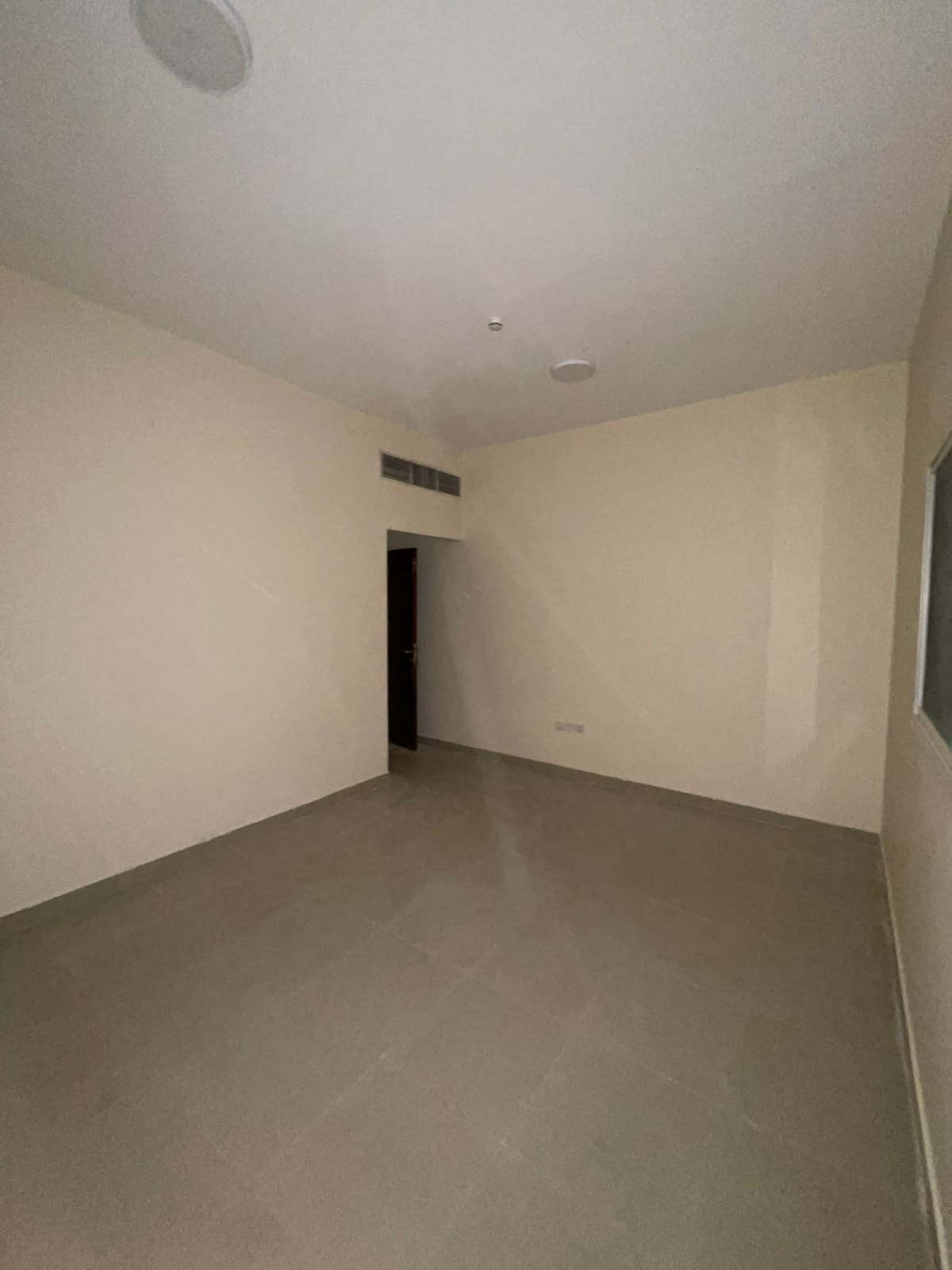 1BR apartment in Muwaileh (official bachelors), 2 bathrooms, balcony, prime location on MBZ Road, near universities & services.
