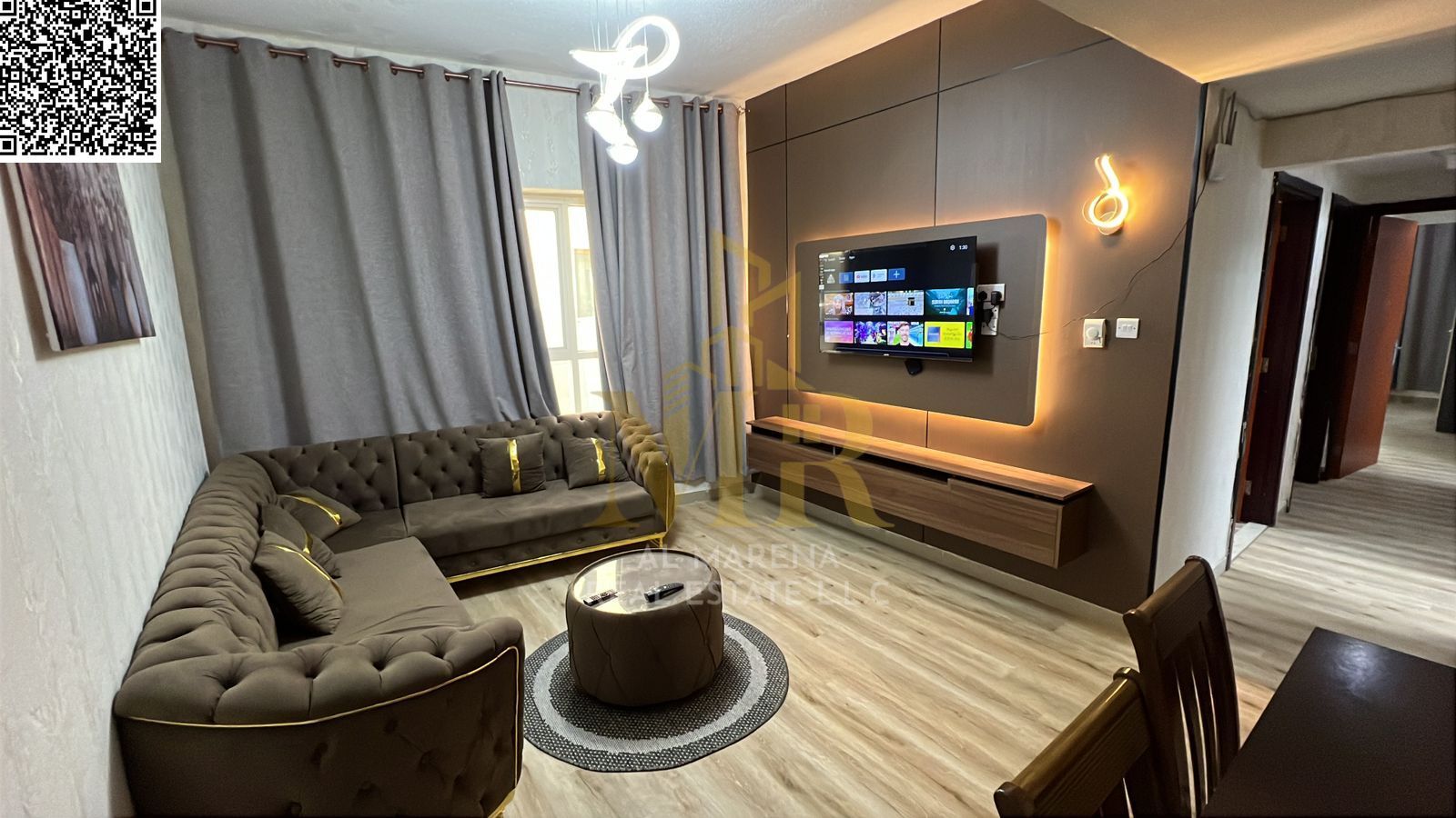 Furnished two-bedroom apartment for sale in Garden City Towers with a modern design and elegant furnishings. Prime location close to essential service