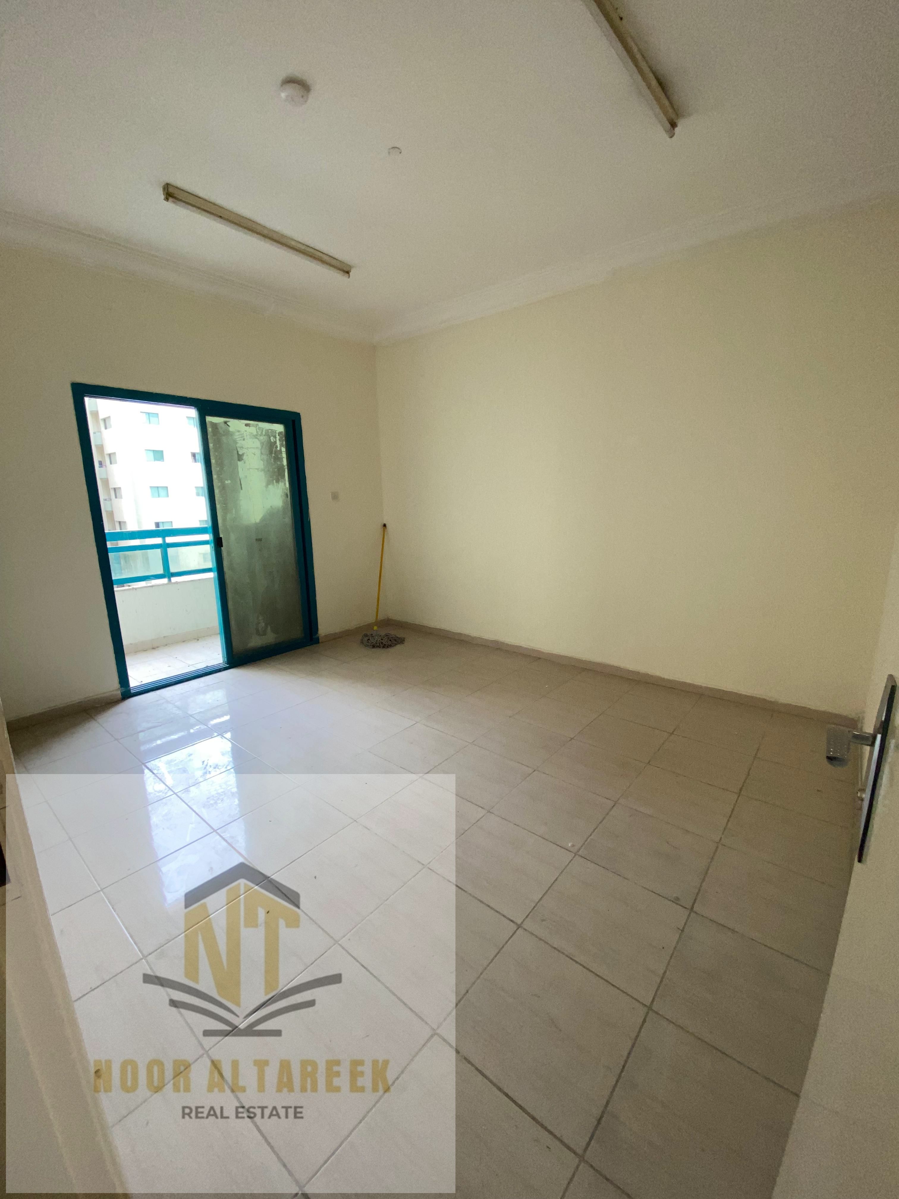 Apartment for annual rent in Al Qasimia, two rooms, a hall, two bathrooms, and a balcony