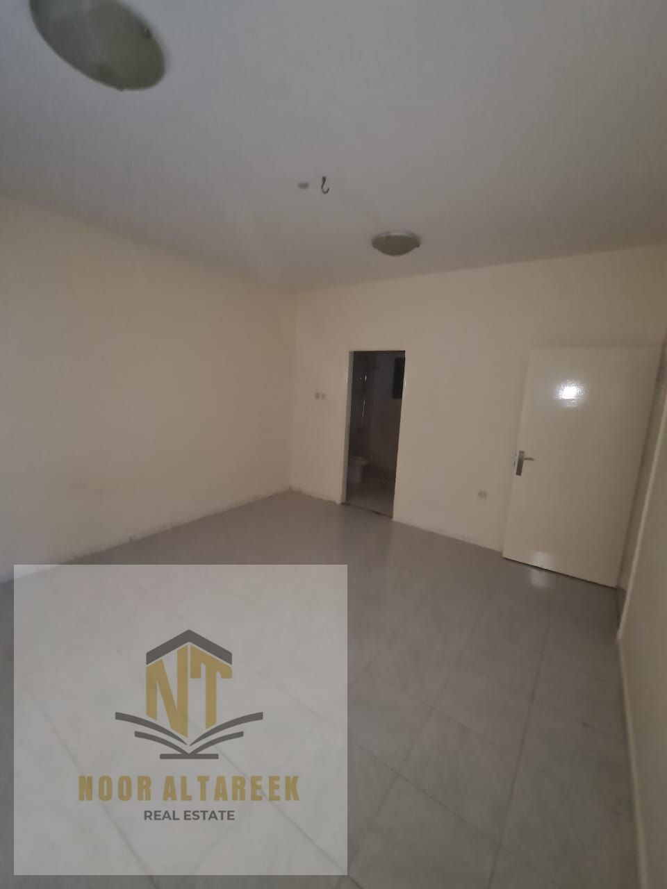 An apartment for annual rent in Al Majaz 3, three rooms, a hall, 3 bathrooms, and a balcony, without administrative fees