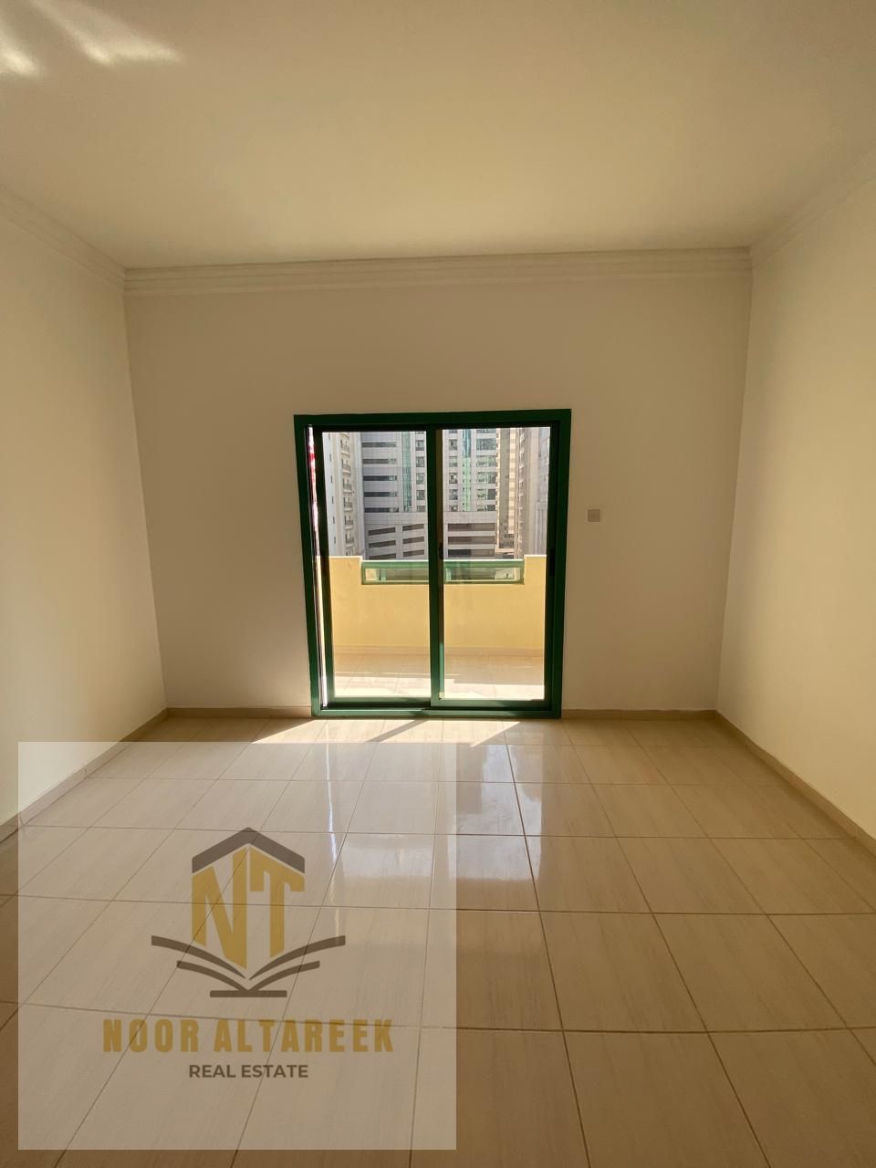 Apartment for rent in Al Taawun area, located in a prime and vibrant neighborhood close to schools, malls, supermarkets, restaurants, and public trans