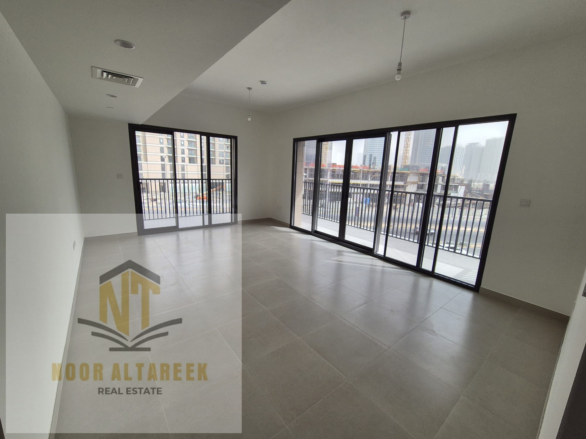 Apartment for sale in Sharjah, Maryam Island, freehold, open to all nationalities. It features two bedrooms, three bathrooms, and a large balcony with