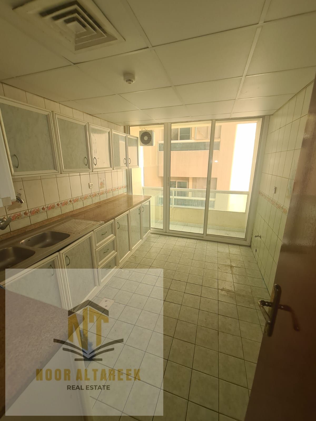 A spacious apartment for rent in Al Taawun, located in a prime and lively area close to all essential services such as shopping centers, schools, rest
