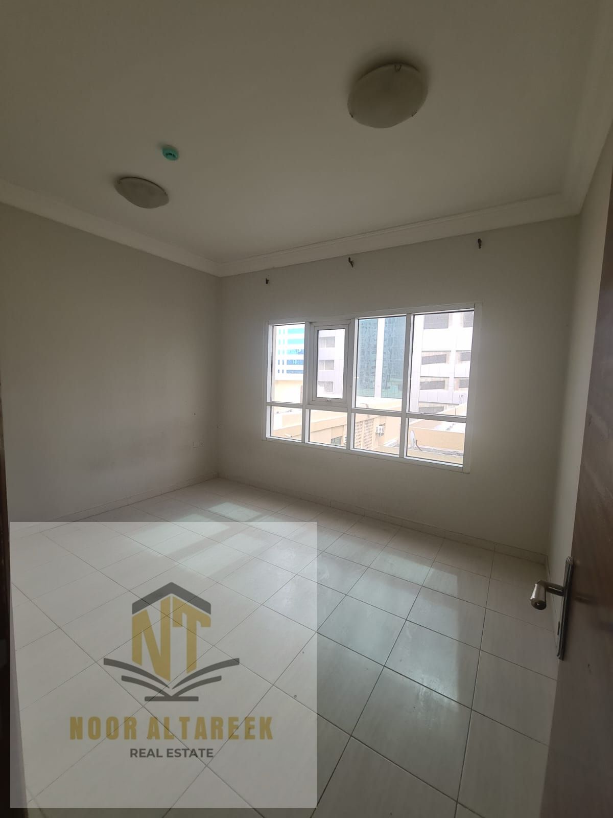 A distinctive apartment is available for annual rent in Al Majaz 1, featuring a strategic location close to all essential services such as markets, s