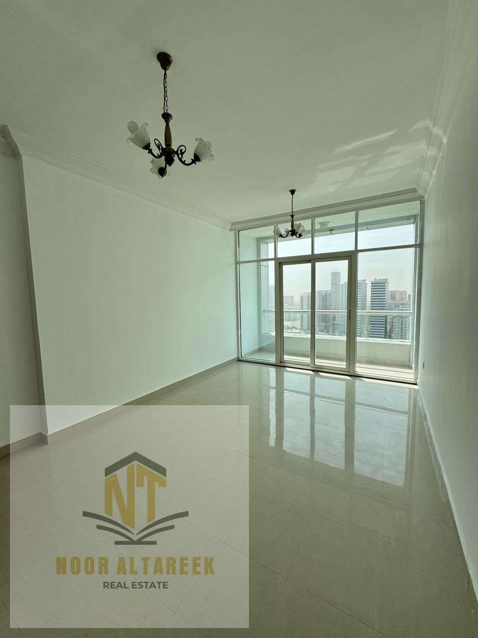 Long Advertisement – English Translation Noor Al Tareeq Real Estate offers a studio for annual rent in the Al Taawun area, featuring a lively, service