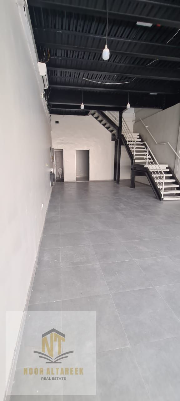 Warehouse for annual rent in Industrial Area 13, with a prime location and easy access to main roads, suitable for all commercial and storage activiti