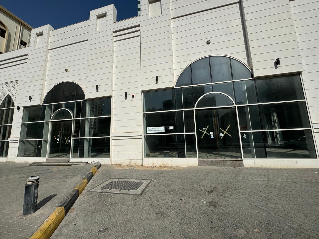 Commercial showroom in Al Qasimia on main road, spacious and suitable for various activities, AED 350,000 yearly, 4 payments, 30,000 deposit.