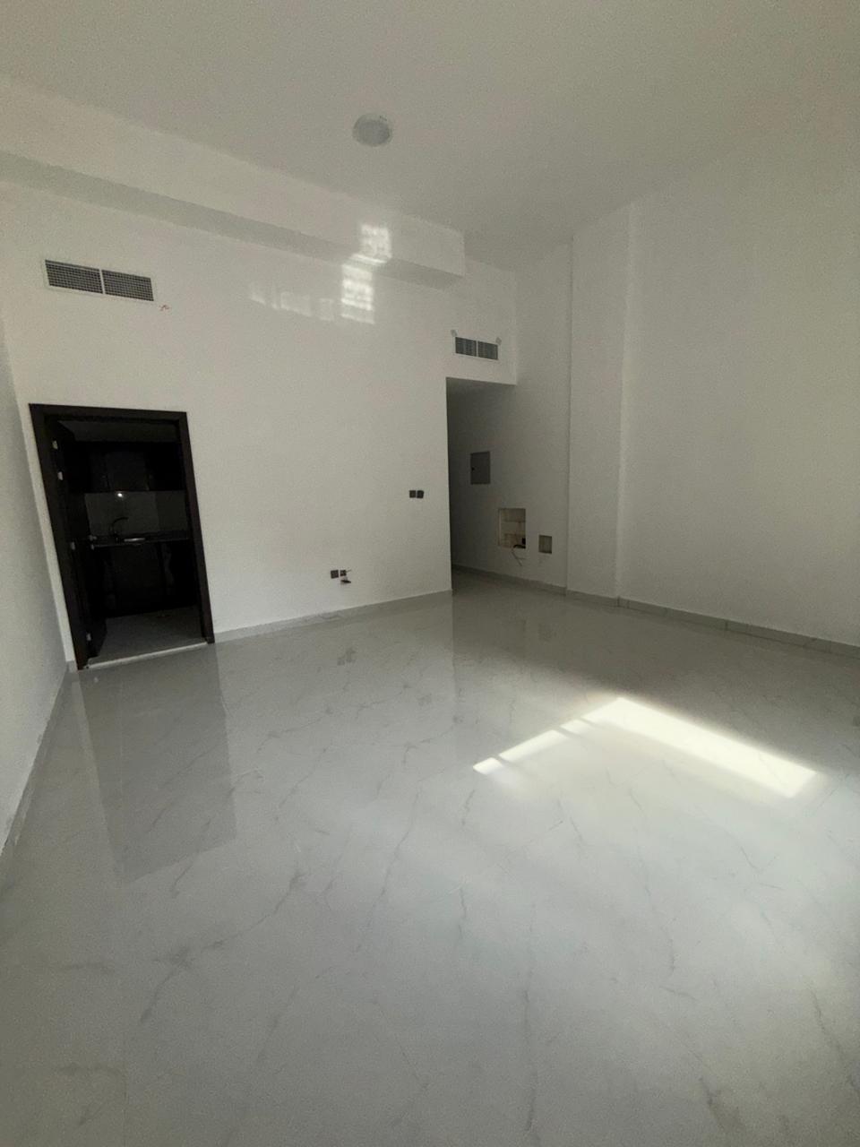 First-time occupancy studio apartment for annual rent – prime location, second row from Ajman Corniche, with ample space and open view
