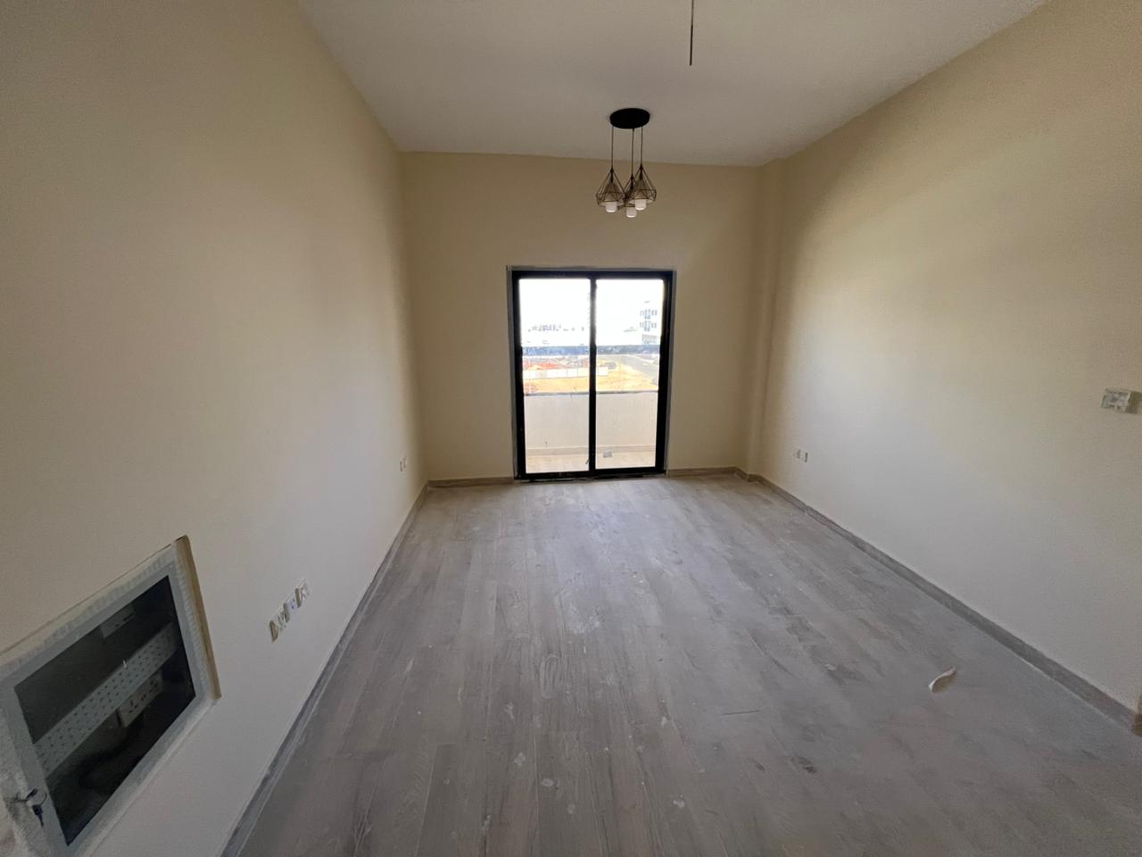 One bedroom and living room apartment for annual rent, first occupancy, in Al Jurf 3, behind the Chinese market. Suitable for families.