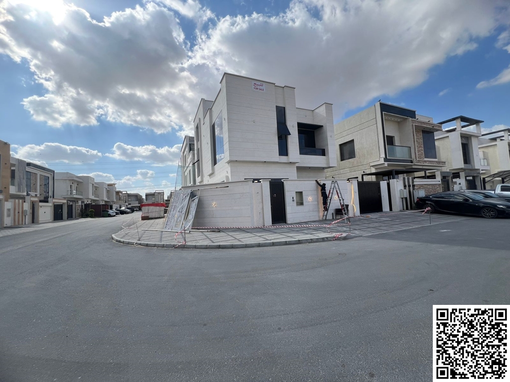 Modern corner villa for sale in Al Yasmeen area, Ajman. Excellent location opposite the mosque. Two floors and a roof. Includes electricity, water, an