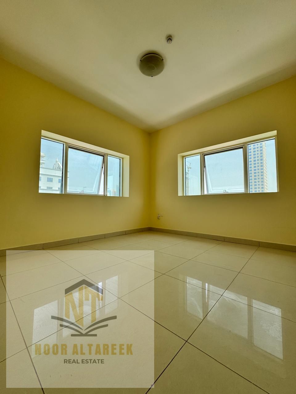 Al Khan apartment has two rooms, a living room, two bathrooms, and central air conditioning