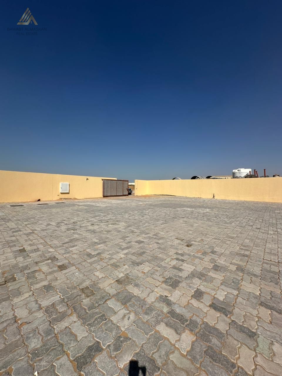 Prime 10,000 Sq. Ft. Open Yard with 27 KVA Power – Al Sajaa Industrial Area