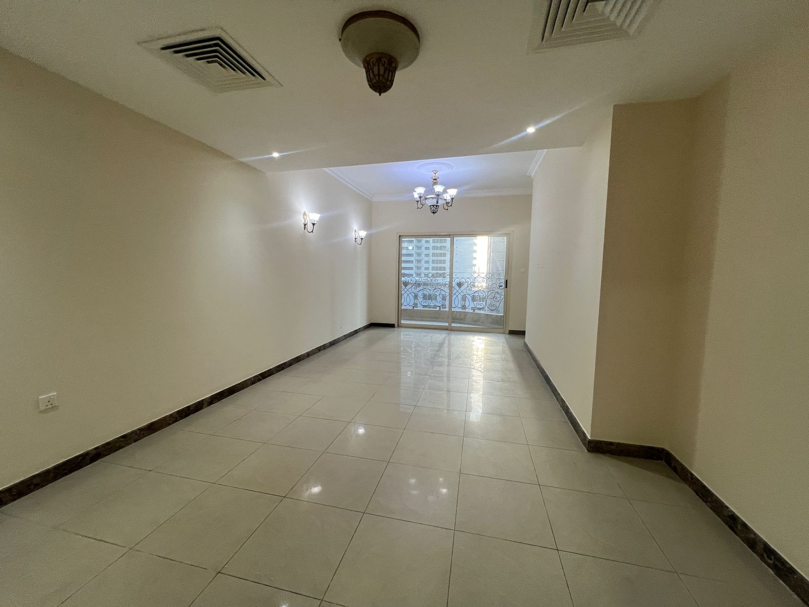 Gym, swimming pool, and kids’ area free. Balcony with open view of Al Taawun Roundabout, built-in wardrobes, central AC and central gas, well distrib