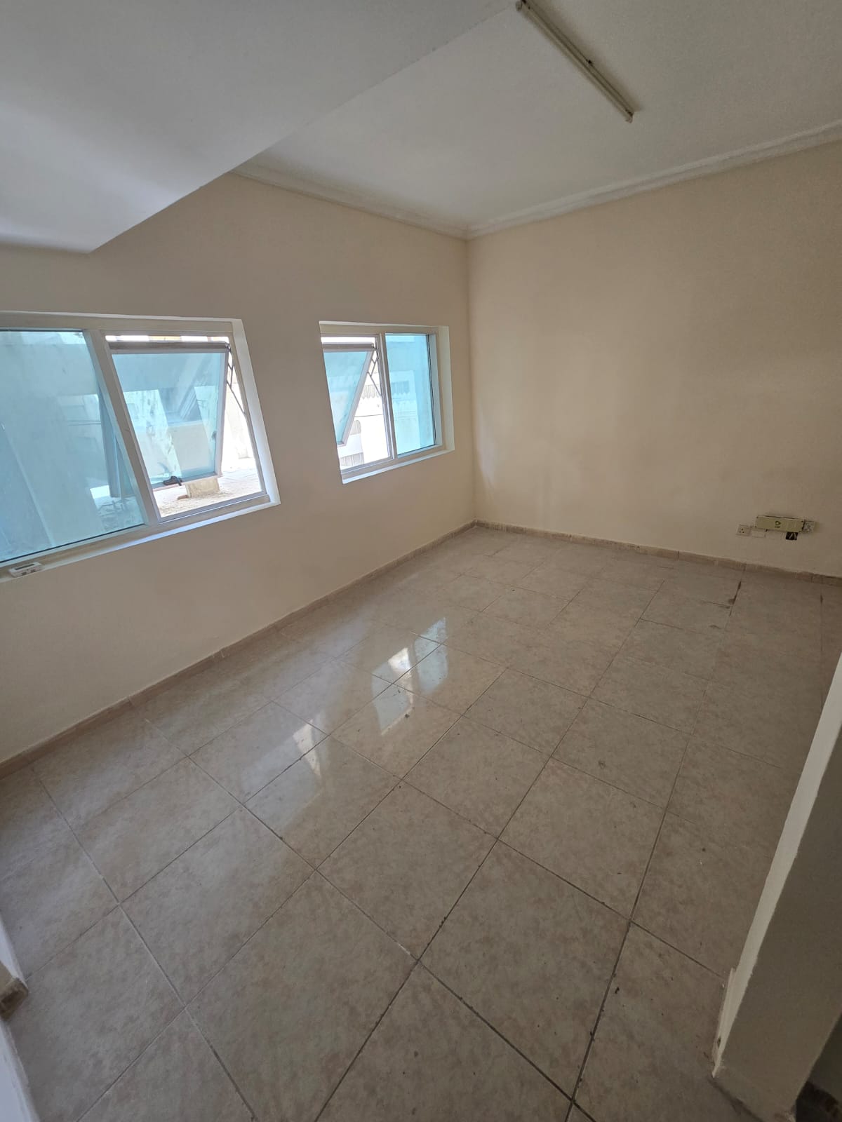 An apartment with one bedroom and a living room in Al Qasimia, excellent location, close to all services.
