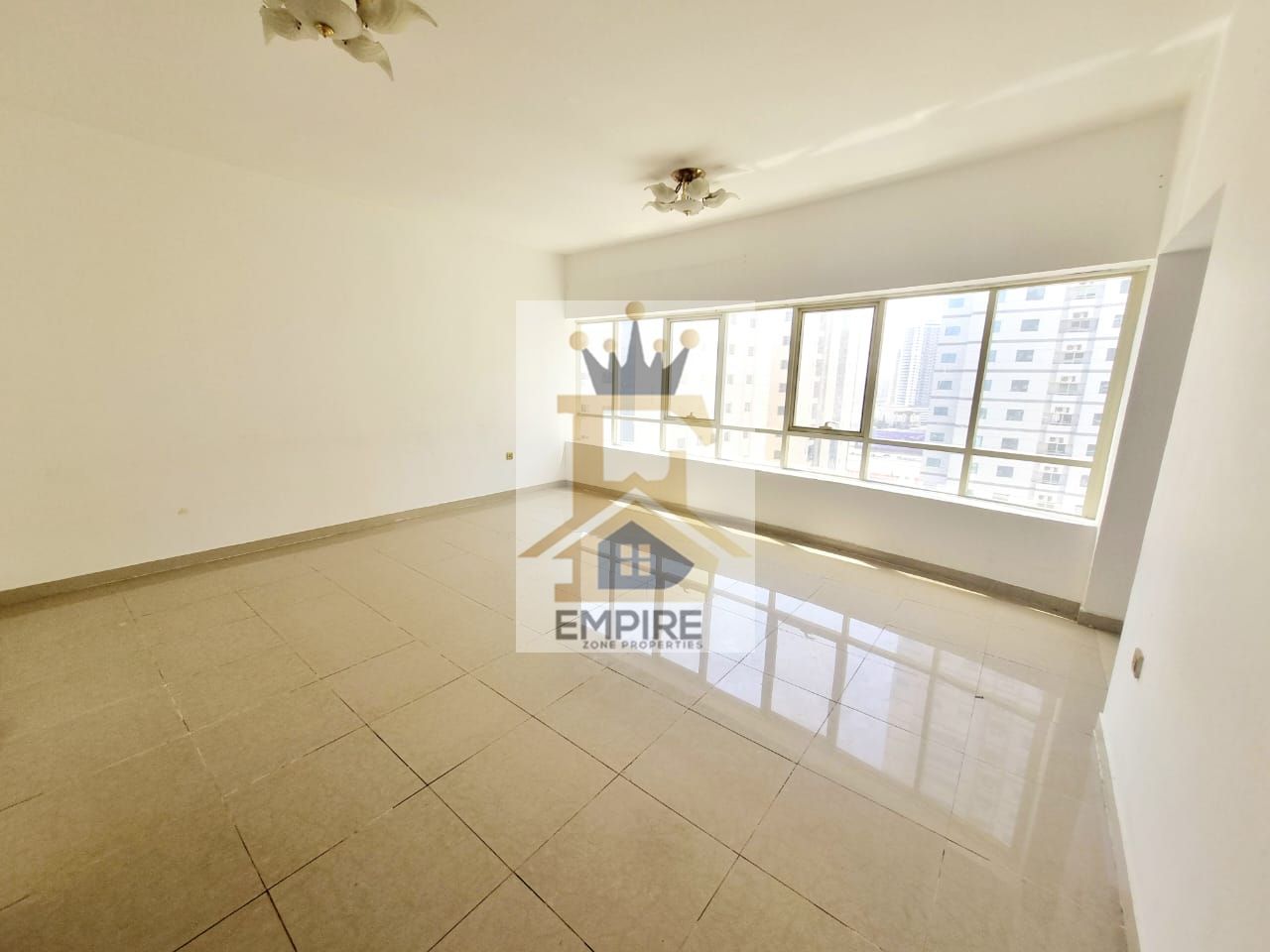 spacious living with huge double hall big windows maid room washing area seprate wardrobes maintenance free parking free prime location one main road building near close exit to dubai