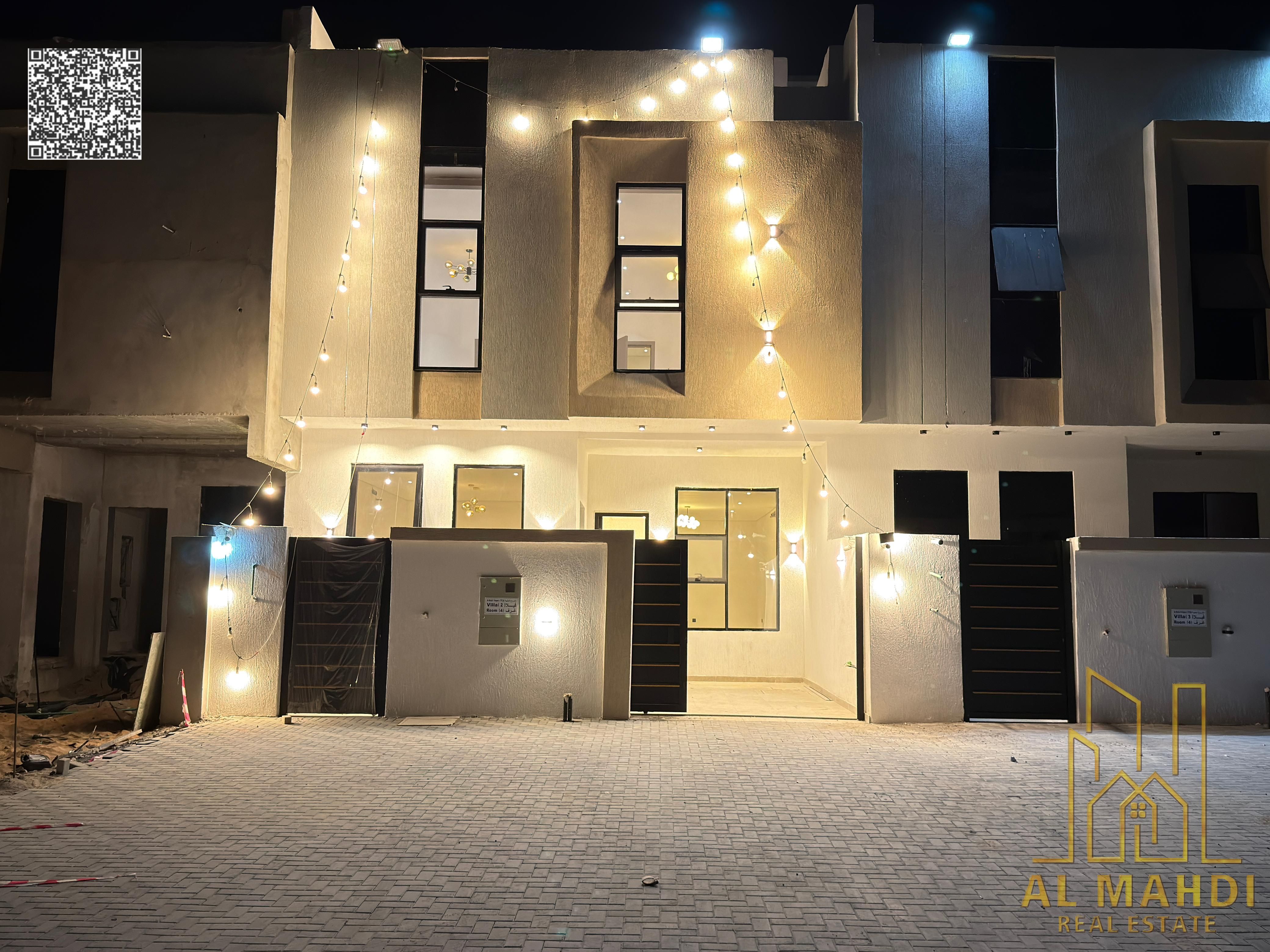 Villa for sale in Ajman, Al Helio 2 area. The villa consists of 4 master bedrooms, a majlis (formal sitting room), a living room, a fully equipped ki