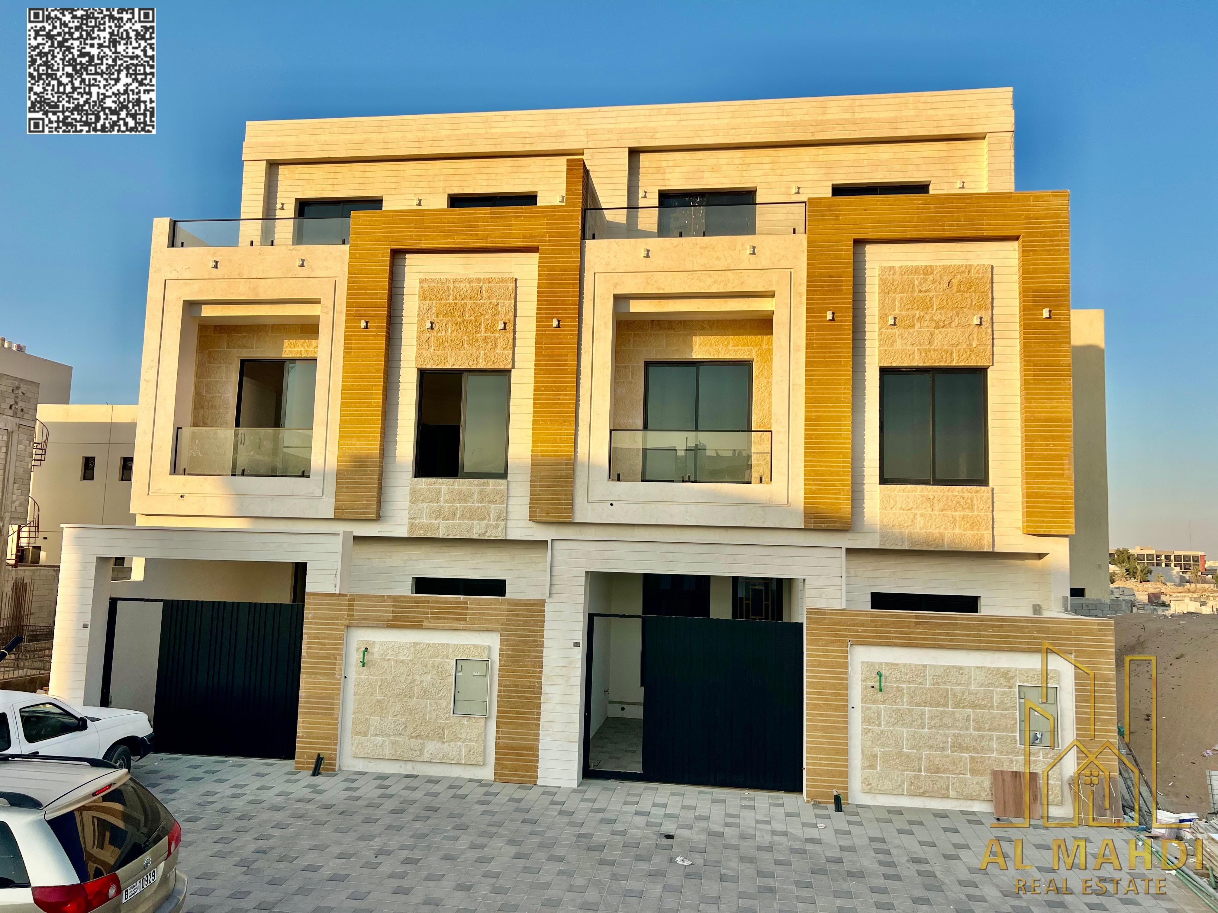 Luxury townhouses in Al Yasmin, Ajman, ready for immediate occupancy, featuring high-end finishes and spacious living areas. Freehold ownership availa