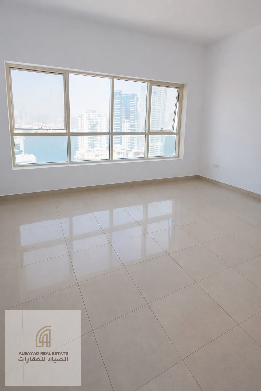Two-bedroom apartment with a living room for sale in Al Khan with an open view, ready to move in, with parking.