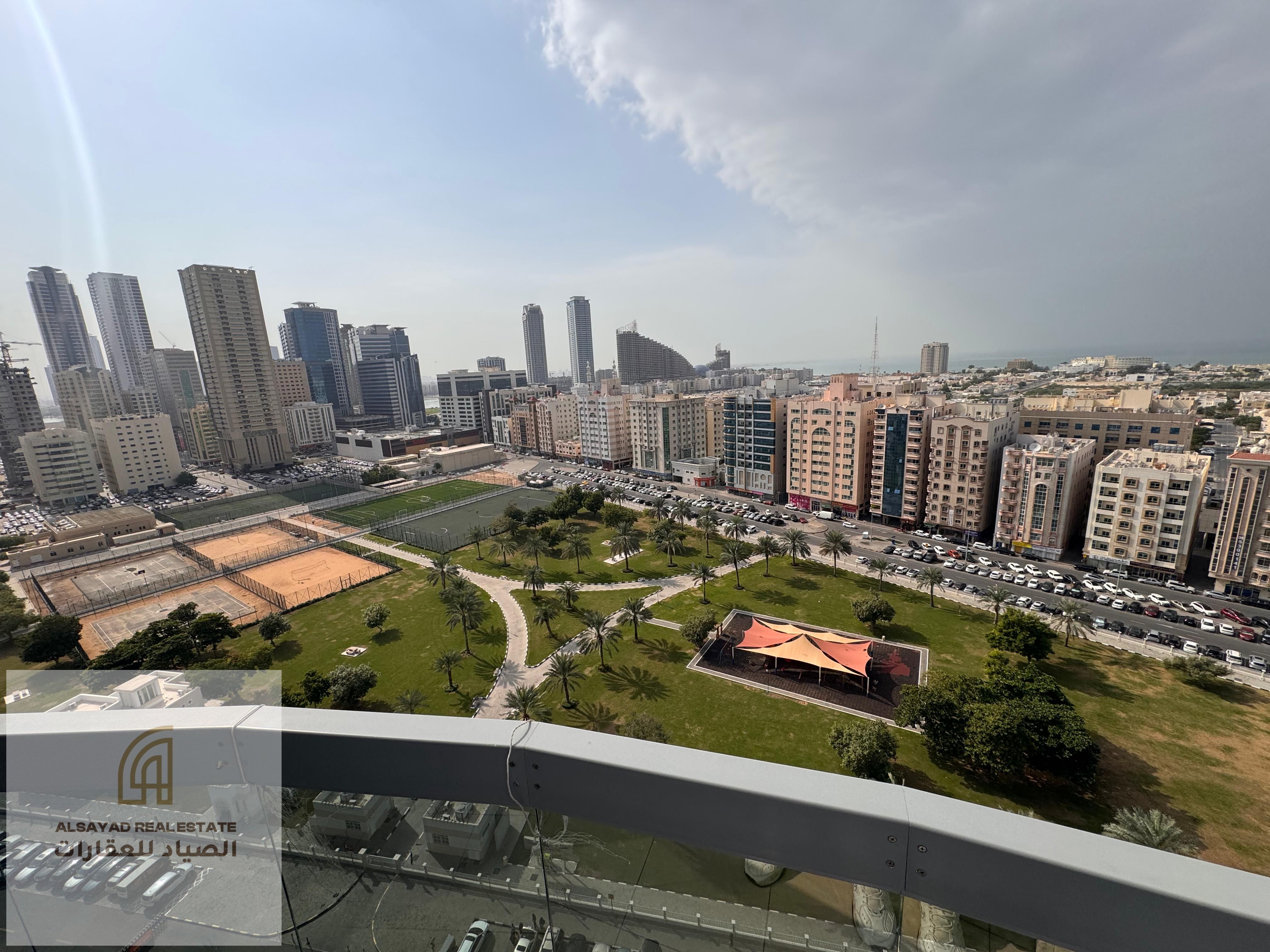 For sale: 3-bedroom apartment with living room in Al Majaz 3, featuring direct open views of Al Safya Park and Al Khan Lagoon. Size: 2,315 sq. ft. , i