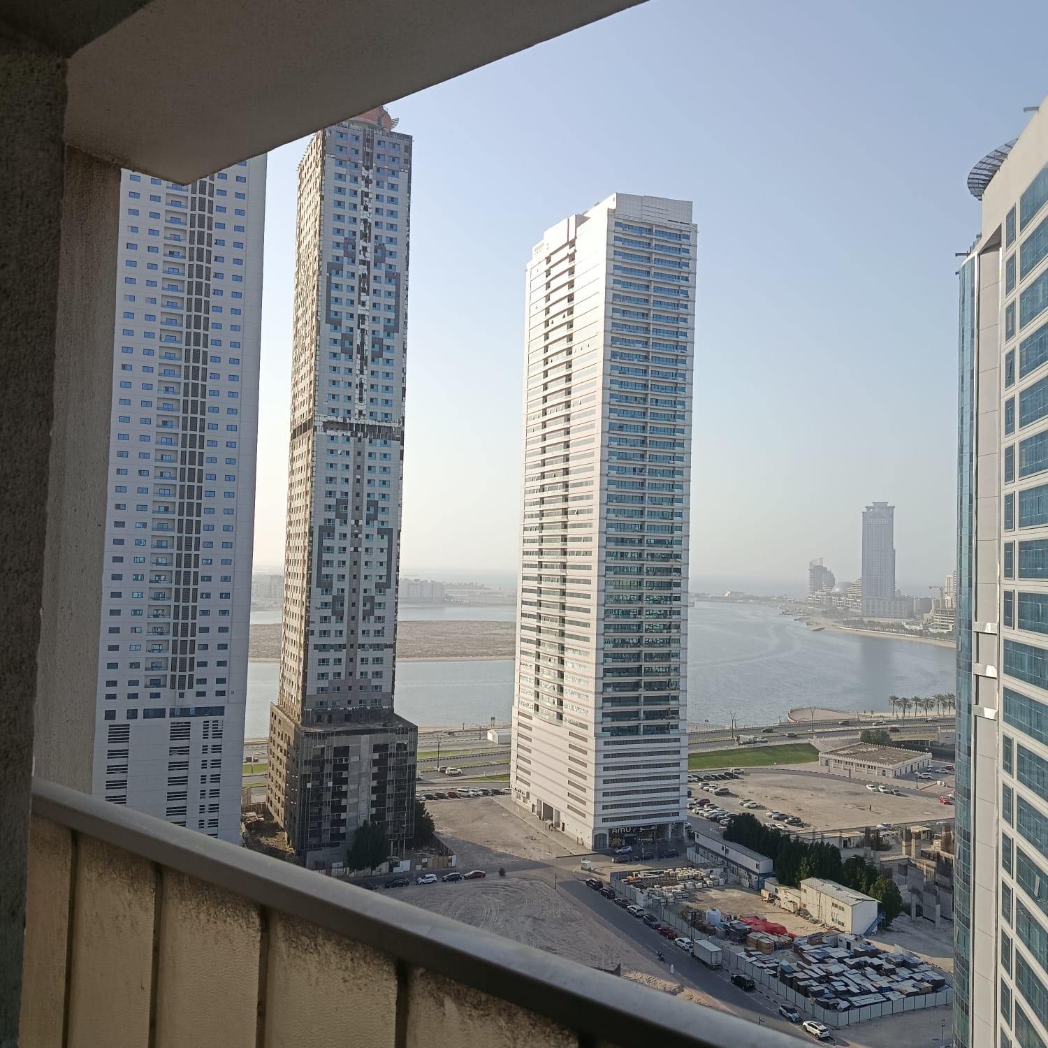 2BR apartment in Al Khan on the lagoon Corniche, direct sea view, balcony, elegant finishing, spacious layout, prime location.