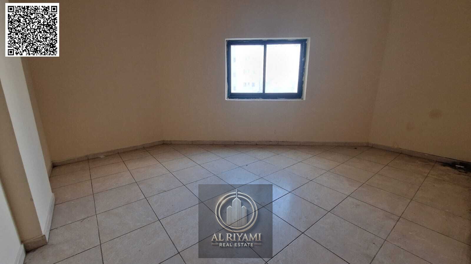Two-bedroom apartment with a living room and balcony, prime location in Ajman Gold Souk.