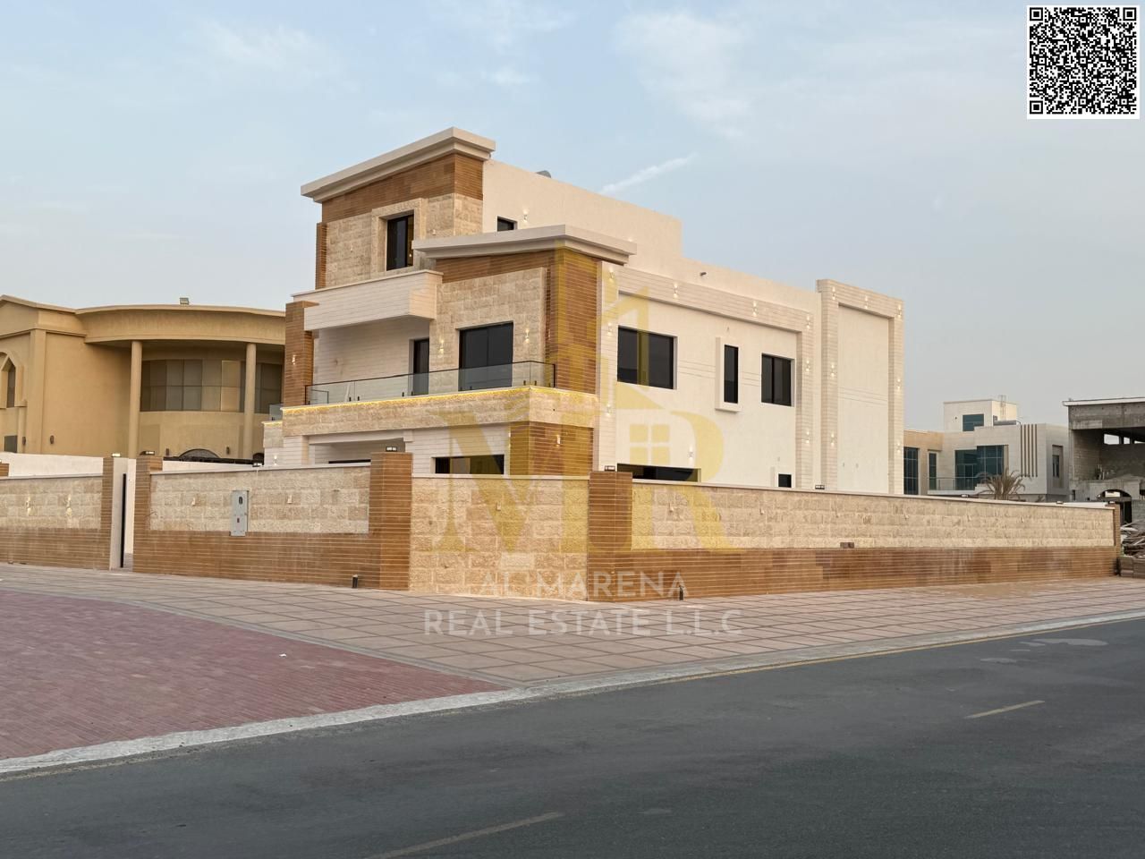 Luxury villa for sale in Al Yasmin, Ajman. 8 master bedrooms, corner unit, three floors, majlis, two living rooms, private pool, ready for elevator in