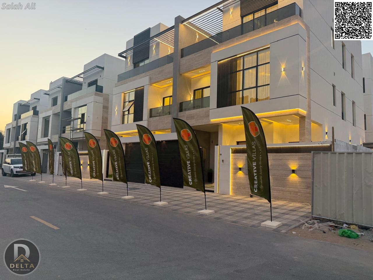 For sale in Al Tallah area, Ajman: a super deluxe 5-bedroom villa with a roof terrace and elevator. Prime location behind Habitat School. Freehold own