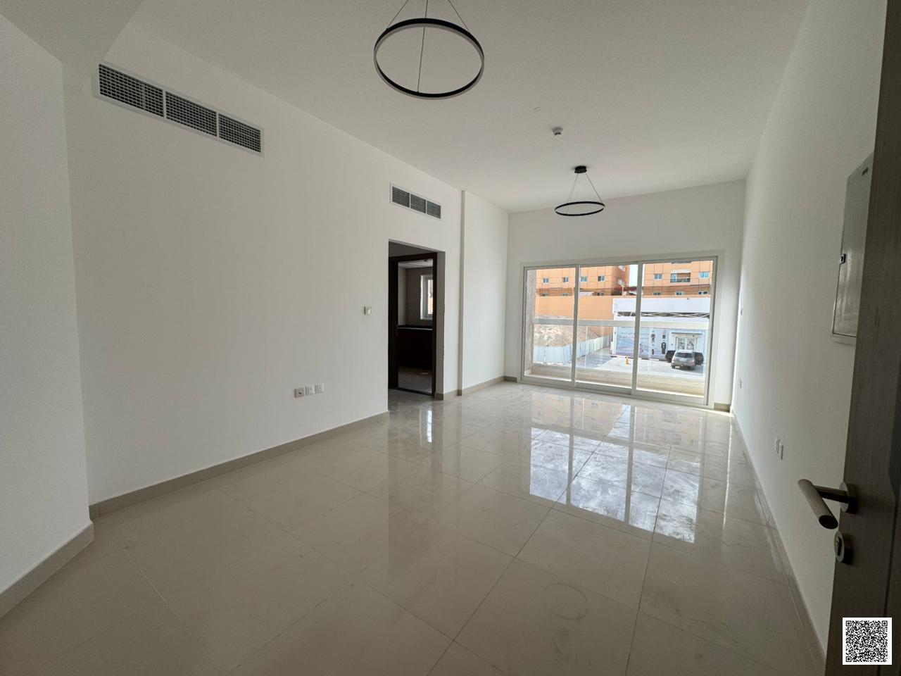 Beautiful 1BR for annual rent in Ajman, master room, spacious hall, balcony, modern lighting and decor, near all services, easy access to Sharjah Duba