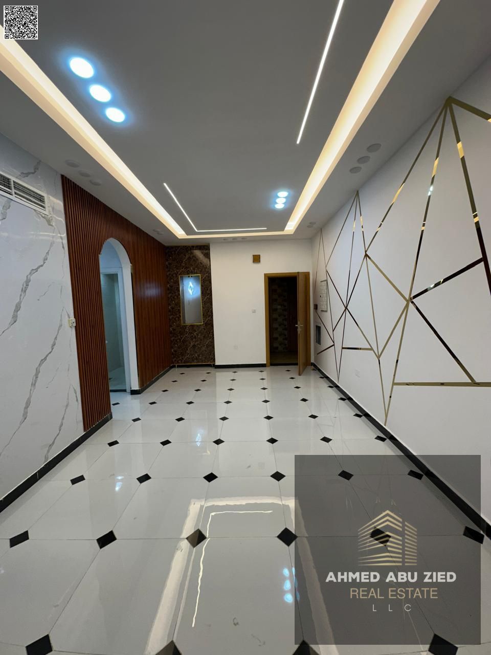 2BR hall in Al Rawda 2, second tenant – spacious hall, 2 baths, central AC, balcony, prime location near services, wide area, luxury finish.