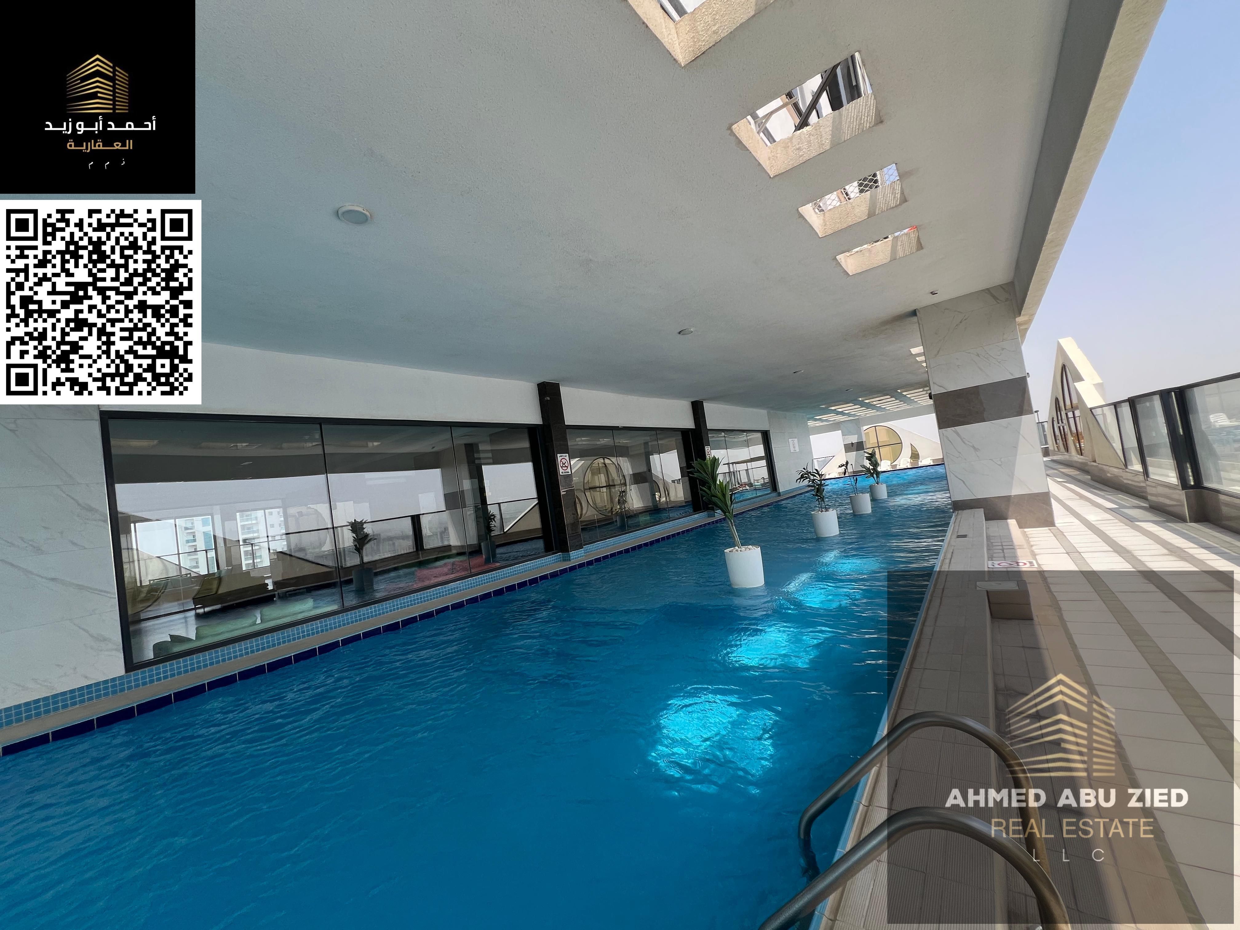 Luxury 2BR + Hall for annual rent in Al Rashidiya, Ajman—gym, pool, aqua park, central A/C, prime location, great facilities. Prices from 55,000 AED.
