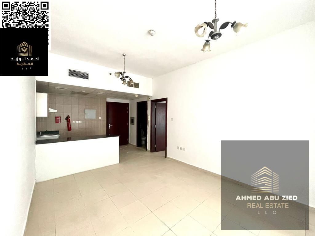 Most beautiful 1BR + Hall for annual rent in City Tower, Ajman, with balcony, 2 bathrooms, kitchen, central A/C, prime location and flexible payments.