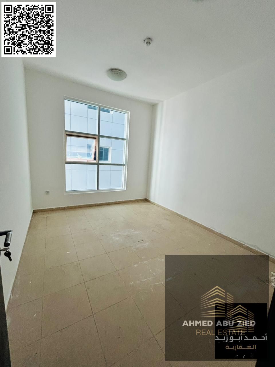 Spacious 2BR + Hall in City Tower, Ajman — big kitchen, central A/C, 38K AED yearly, flexible payments, prime location near all services.