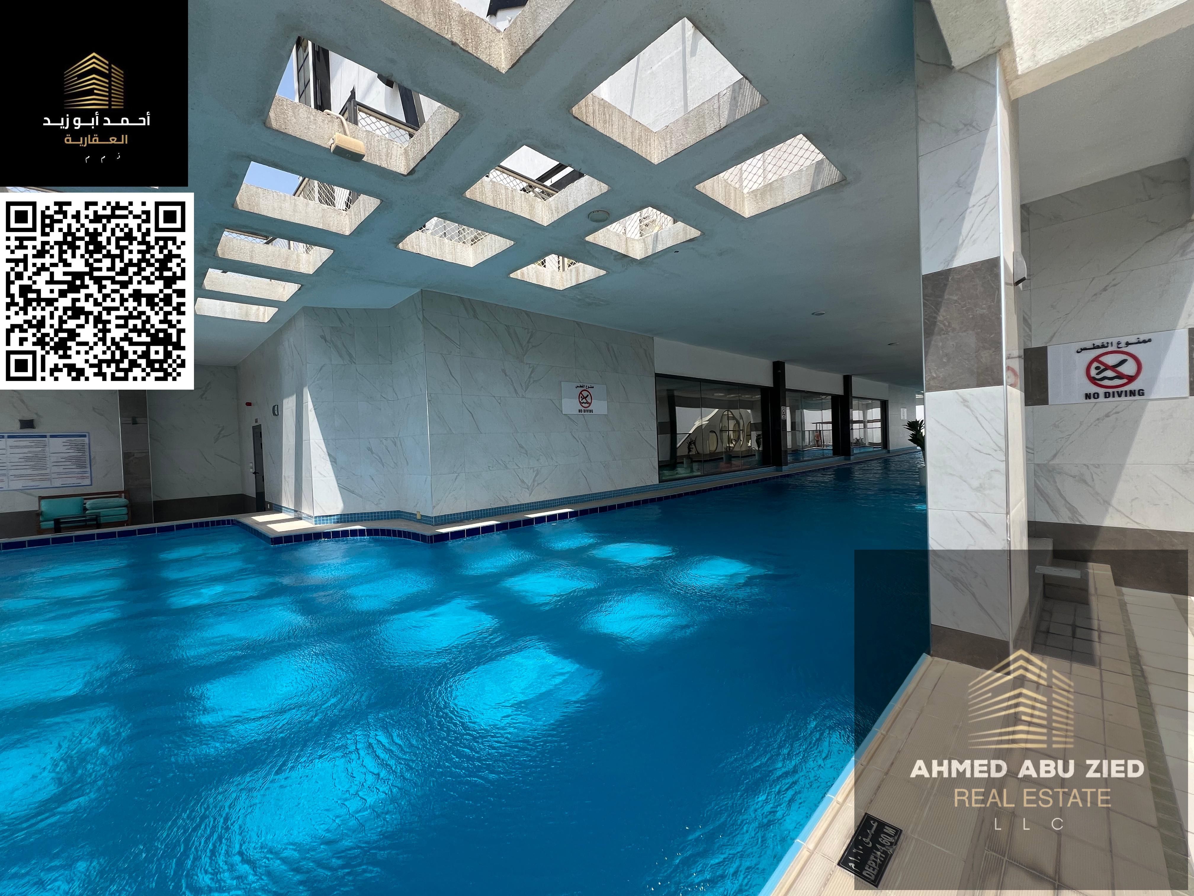 Luxury 2BR + Hall in Al Rashidiya with gym, pool, aqua park & equipped kitchen. Starting from 55K AED with flexible payments.