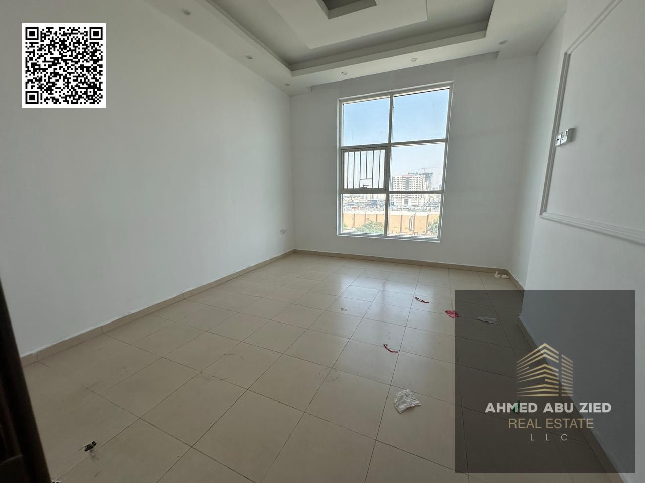 Luxurious two-bedroom apartment with a living room and a full open city view for annual rent in City Towers, Ajman, close to all services and exits.