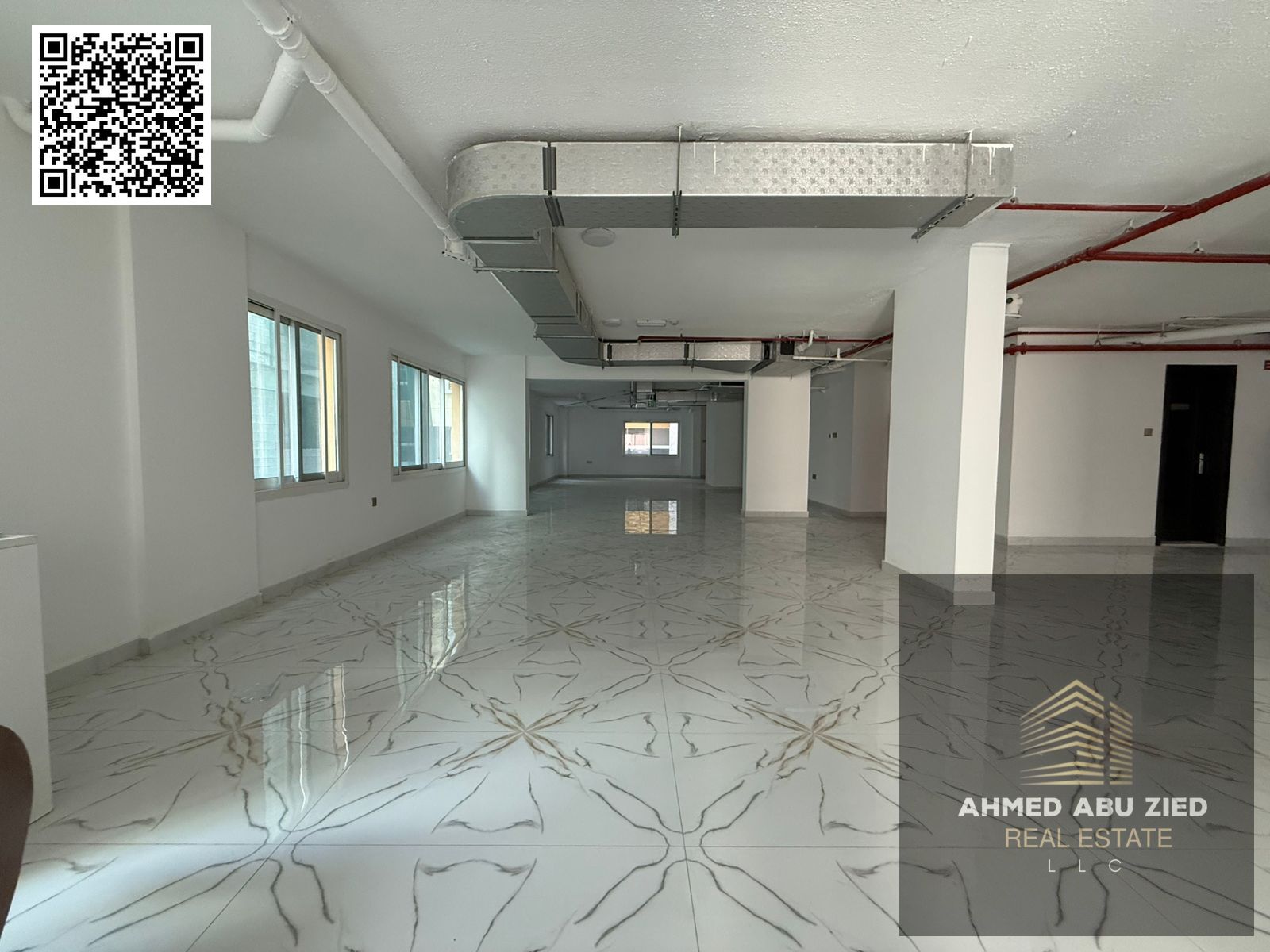 office or commercial floor in Al Muwaihat 3, within a new building in a prime location ideal for commercial and administrative activities.