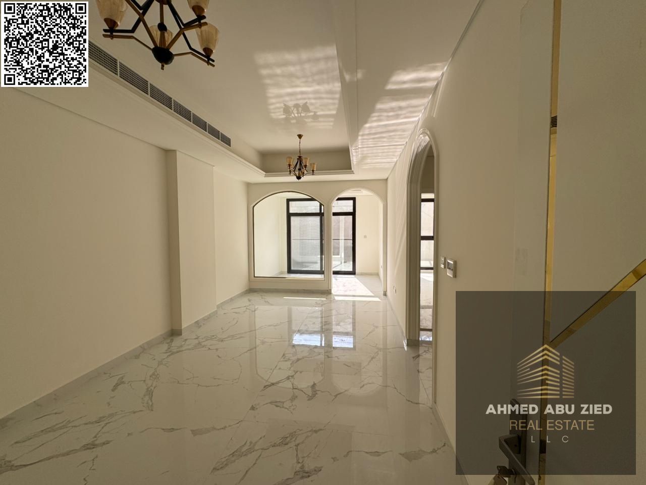 First tenant elegant 1BR hall with free month, open-view balcony, built-in wardrobes, separate hall & majlis, modern refined finishes, prime location