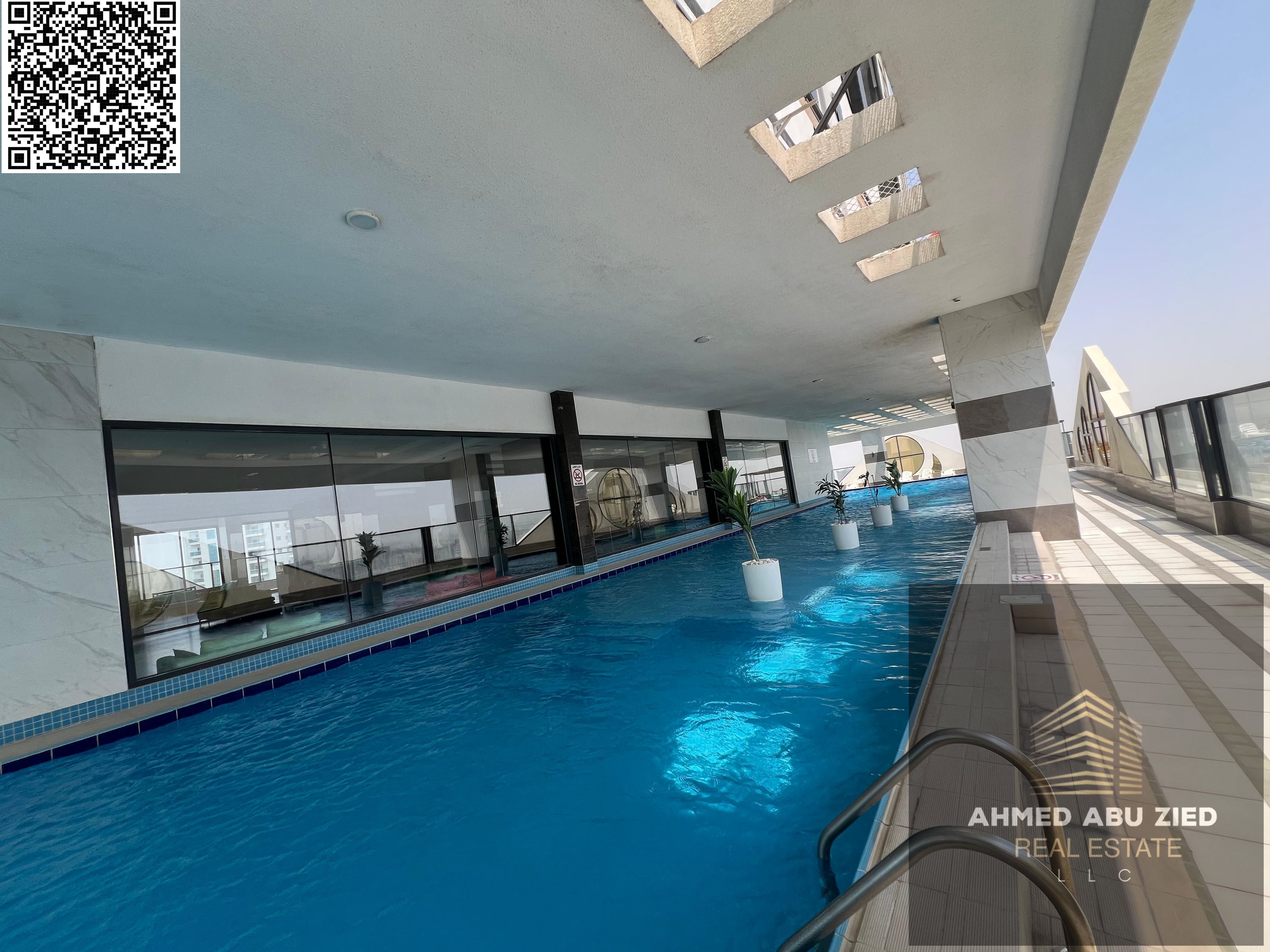 Elegant 1BR hall, first tenant, free month, free gym, pool & aqua park, built-in wardrobes, open-view balcony, modern finishes, prime location near se