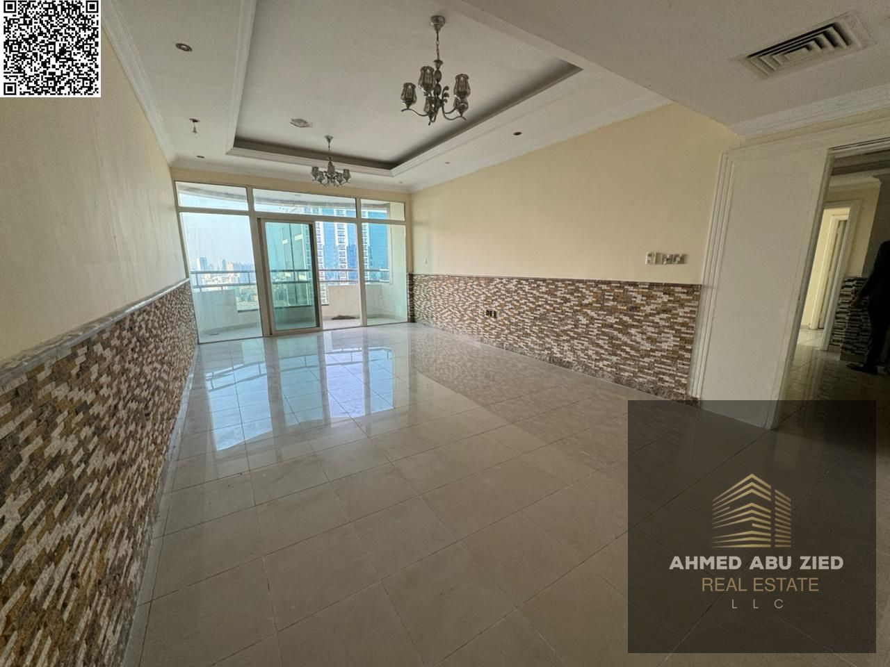 Spacious elegant 2BR hall in Ajman with 3 bathrooms, sea-view balcony, large area, modern refined finishes, prime location close to all services.